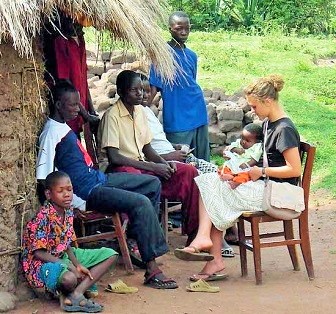 A tourist with the locals experiencing african life - cultural tourism